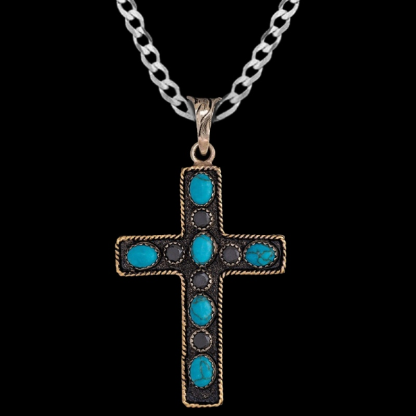 James, Beautiful German Silver cross 1.6"x2.3" with a Jewelers Bronze rope edge and simulated turquoise and cubic zirconias.
